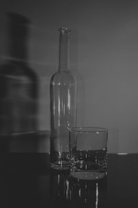 Close-up of glass bottle on table