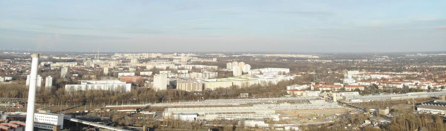 High angle view of buildings in city against sky