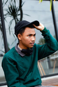 Portrait of young man standing outdoors