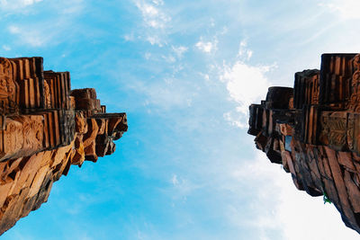 Directly below shot of old ruins against blue sky