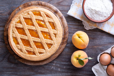 High angle view of peach jam tart on table