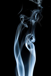 Close-up of smoke against black background