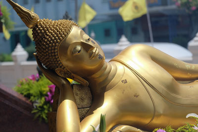 Close-up of buddha statue at temple
