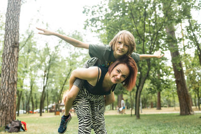 Side view of woman exercising in park