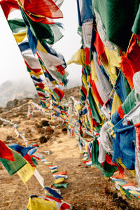 Multi colored flags hanging on clothesline