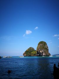 Scenic view of sea against blue sky