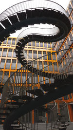 Low angle view of spiral staircase in building