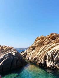 Scenic view of sea against clear blue sky