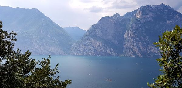 Scenic view of lake and mountains against sky