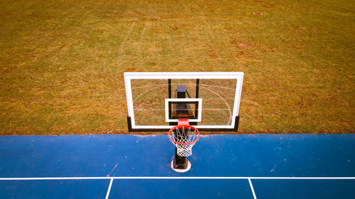 Vibrant blue basketball court at menasha wisconsin urban park 