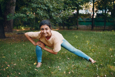 Portrait of smiling young man on field