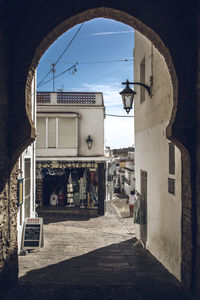 Alley amidst buildings in city