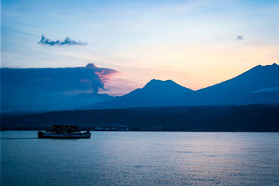 Scenic view of river against sky during sunset