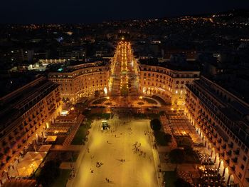 High angle view of illuminated buildings in city at night