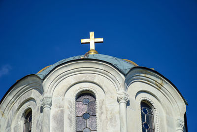 Low angle view of building against blue sky