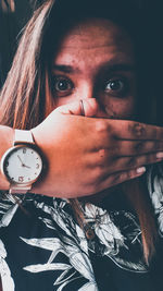 Portrait of beautiful woman with hand holding hair