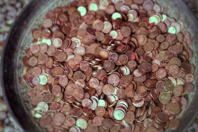 High angle view of coins in container