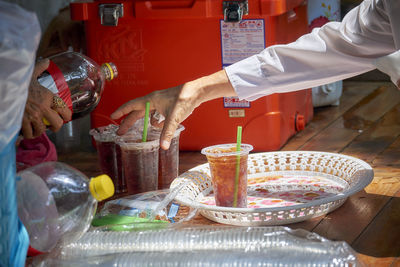 Midsection of man preparing food in kitchen