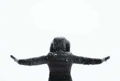 Rear view of woman against white background