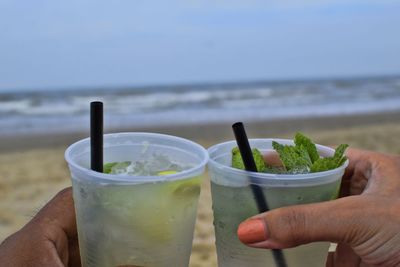 Close-up of hand holding drink