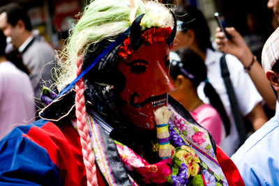 Close-up of person wearing mask during traditional festival
