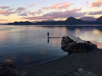 Scenic view of lake against sky during sunset