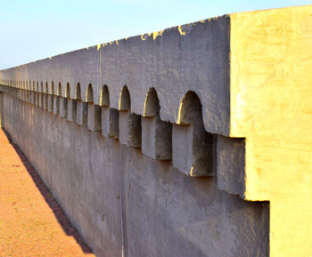 Low angle view of wall against sky