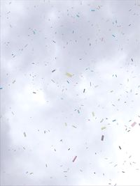 Full frame shot of confetti falling against sky