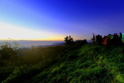 Panoramic view of field against sky during sunset