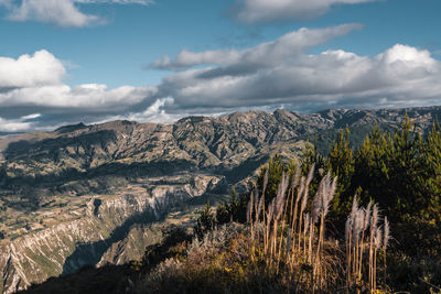 Panoramic view of landscape against cloudy sky