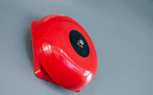 Close-up of red toy over white background