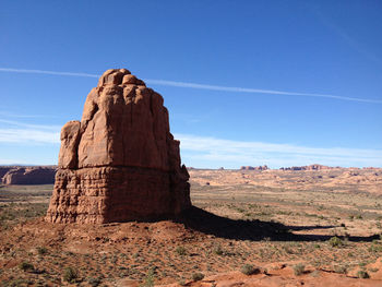 Scenic view of landscape against blue sky