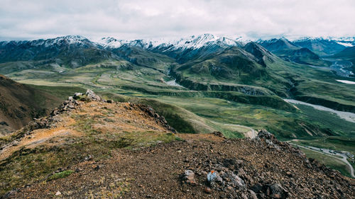 Scenic view of landscape and mountains against sky