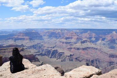 Rear view of woman on south rim of grand canyon in midday sun