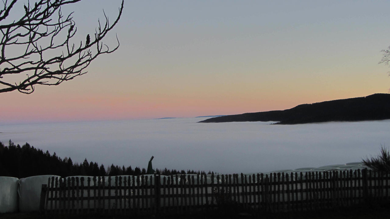 SCENIC VIEW OF SEA AGAINST ORANGE SKY