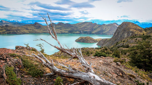 Scenic view of lake and mountains against sky