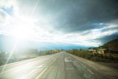 View of road against cloudy sky