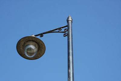 Low angle view of street light against sky