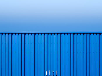 Cargo container against clear blue sky