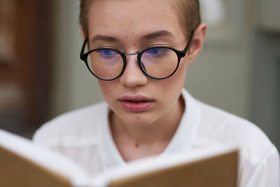 Close-up portrait of a serious young woman