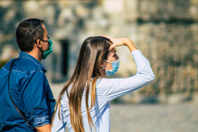 Young couple standing outdoors