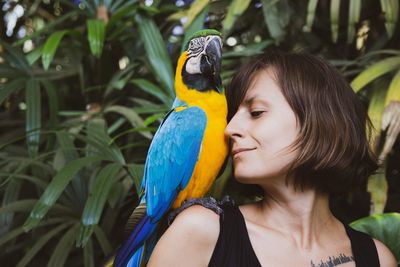 Smiling with tamed parrot on my right shoulder