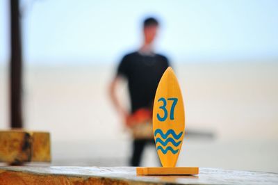 Number 37 on wood with man in background