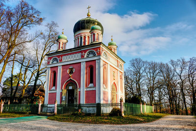 Low angle view of church against cloudy sky