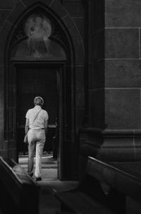 Rear view of woman at entrance of church