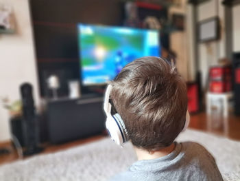 Rear view of boy at home