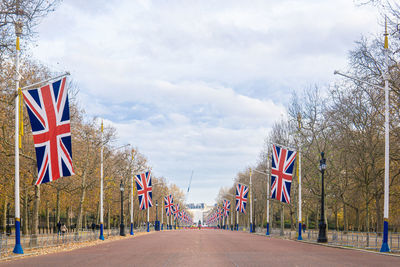 View of flag on road against sky