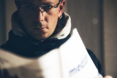 Close-up portrait of man wearing eyeglasses