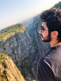 Young man looking at mountains