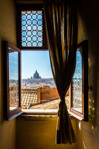 Buildings seen through glass window